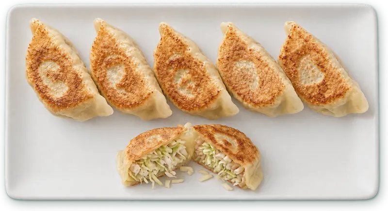 Gyoza poulet : 6 raviolis grillés vapeur · poulet, chou, gingembre